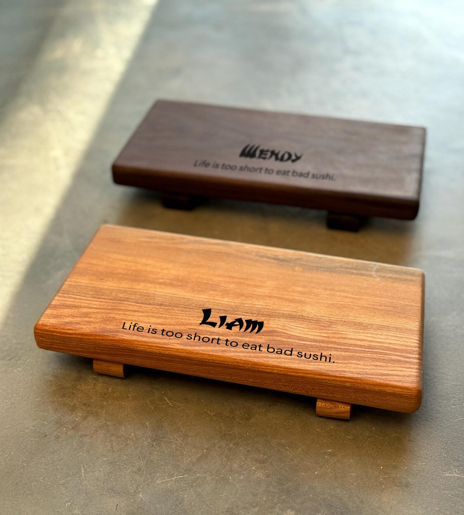 Maple and walnut wooden susho boards showing the personalized engravings