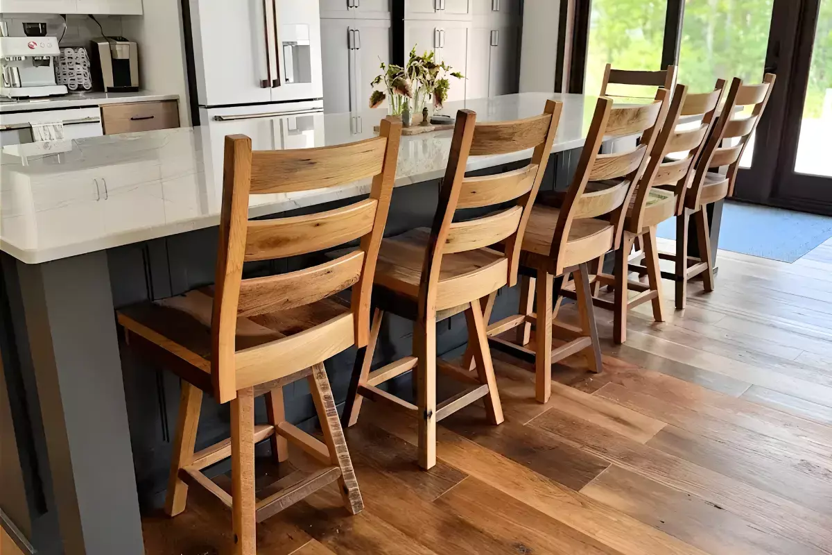 Akron wood bar stools paired with matching dining furniture at kitchen island