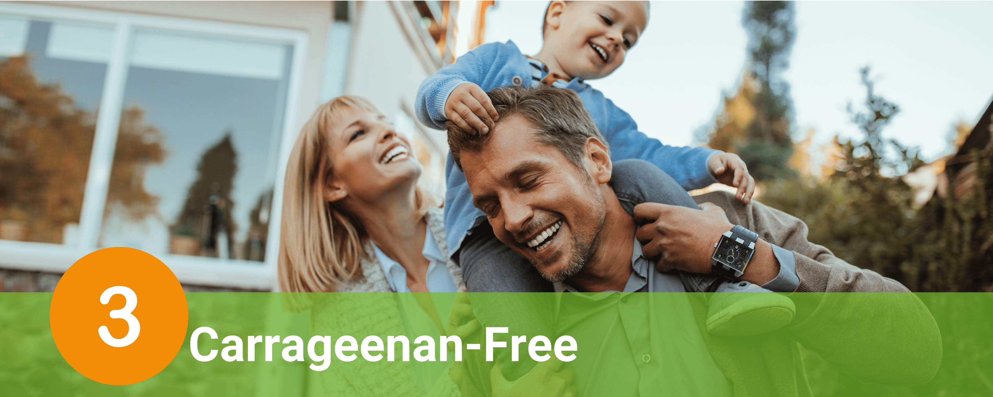 A man, woman and child laughing together while playing outside