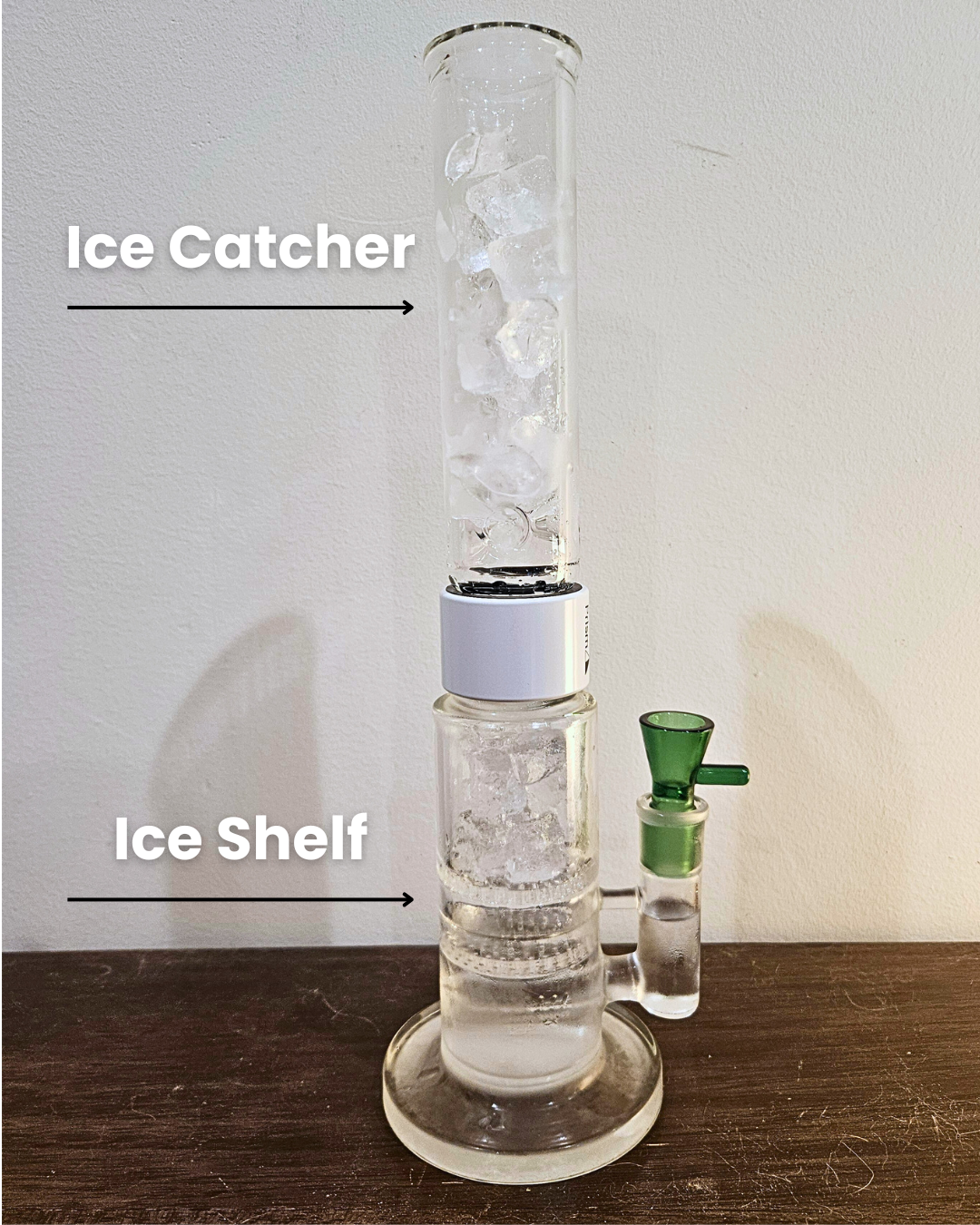 Clear Prism Modular Single Stack Big Honeycomb Bong, featuring a white Halo connector and green bowl, demonstrating the "Ice Shelf" technique. Diagrammatic lines indicate how to place ice directly onto the honeycomb percolator, showcasing its dual function as an efficient smoke cooler and an additional ice catcher in the modular design.