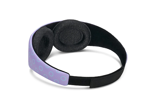 Back view of purple sleep mask for kids with adjustable head strap and tapered eye cups.