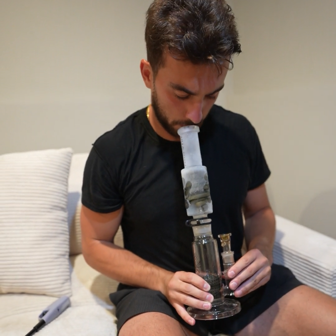 Man holding a straight tube