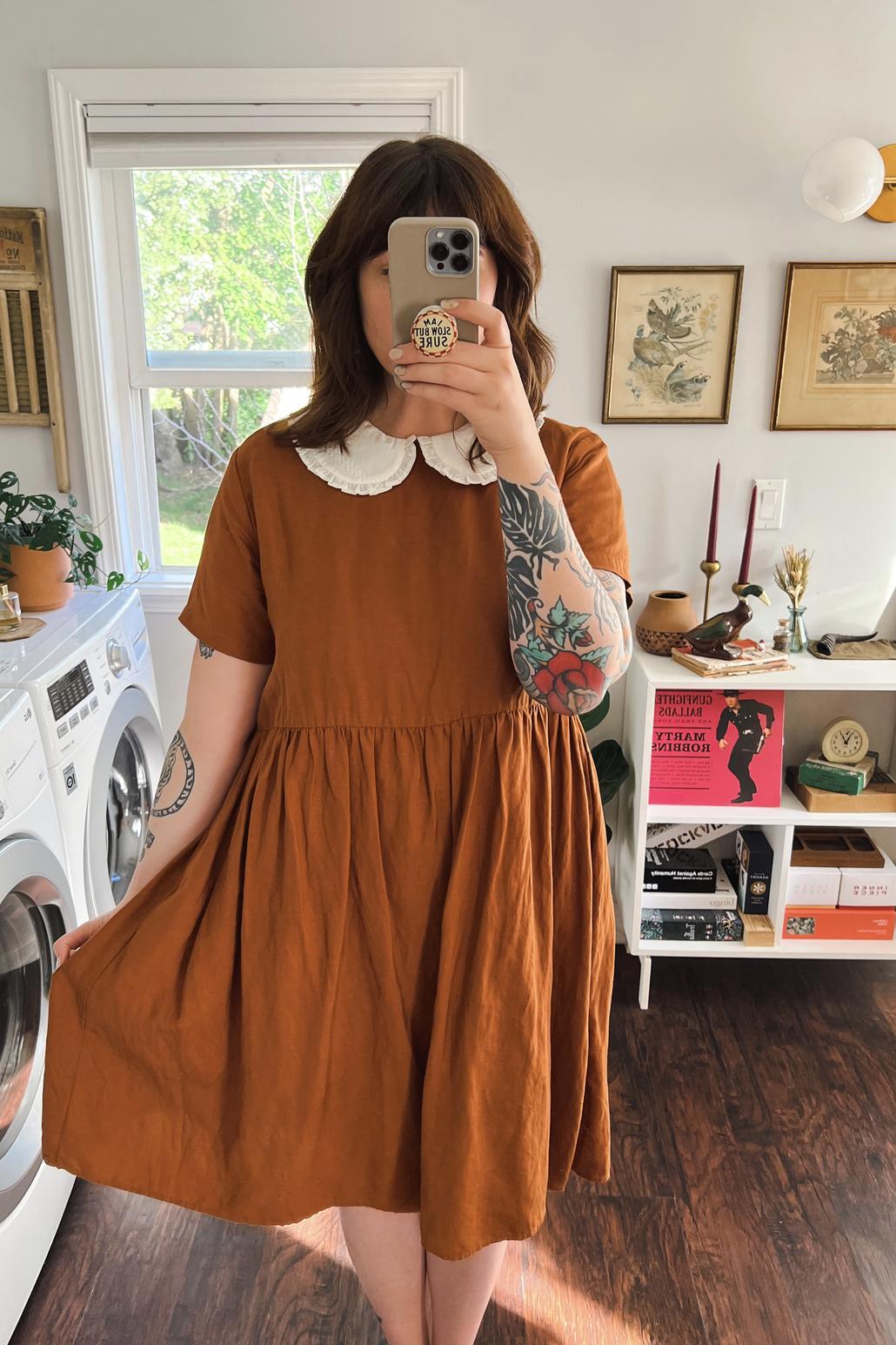 Ambassador Kayla wearing orange nico dress