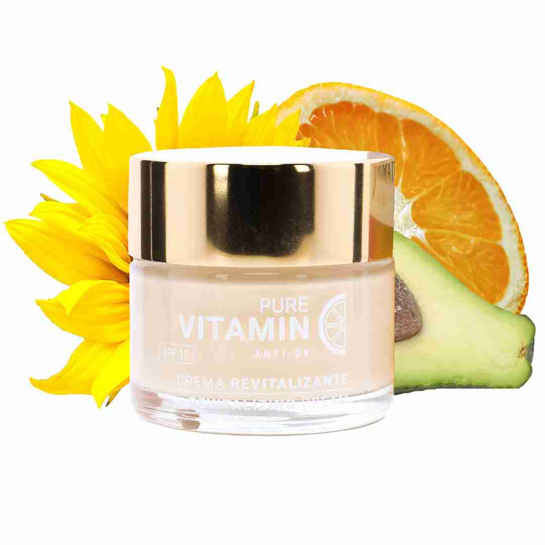 Pictured is Noche Y Dia's Vitamin C Face Cream surrounded by citrus slices and flowers.