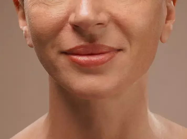A woman with a vibrant smile
