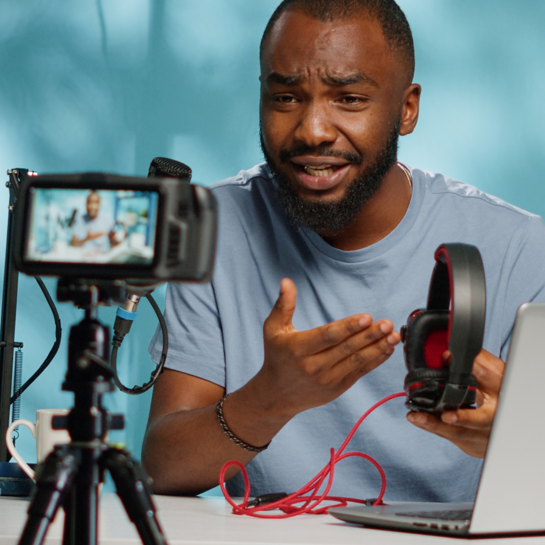 Man recording video with mobile phone case and tripod