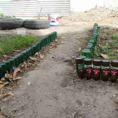 In the community garden we recycle everything we can. Here we have our old beer bootle walkway