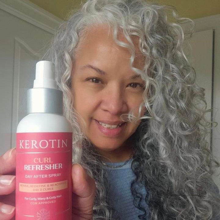 silver curly hair woman with curl refreshing spray