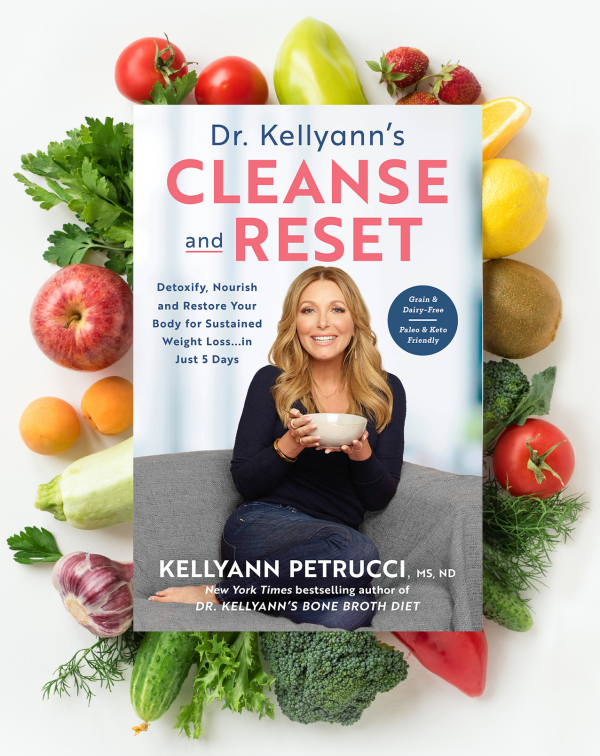 Dr. Kellyann book surrounded by fruits and vegetables