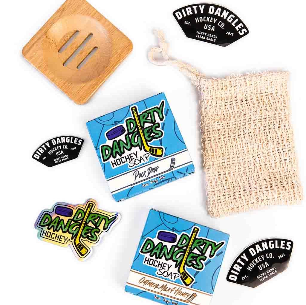 Dirty Dangles 2 games on the beach hockey soap bar with product box on a white background.