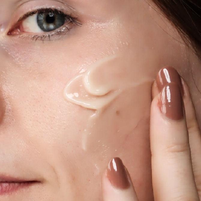 woman applying Smooth-Sorbet Oil-Free Face Gel Crème on face 1