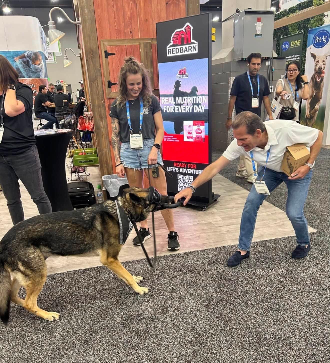 redbarn booth with reno playing tug