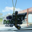 A dirty dangles hockey car air freshener hangs from a rear view mirror. dirty dangles hockey