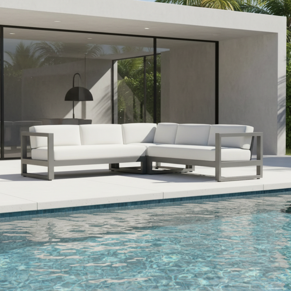 a sectional chai on the side of a pool