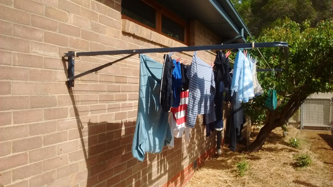 Eco 300 clothesline installed on brick wall