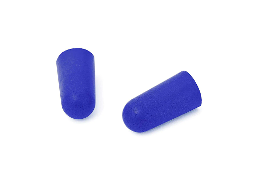 A pair of blue earplugs made from slow-release foam.
