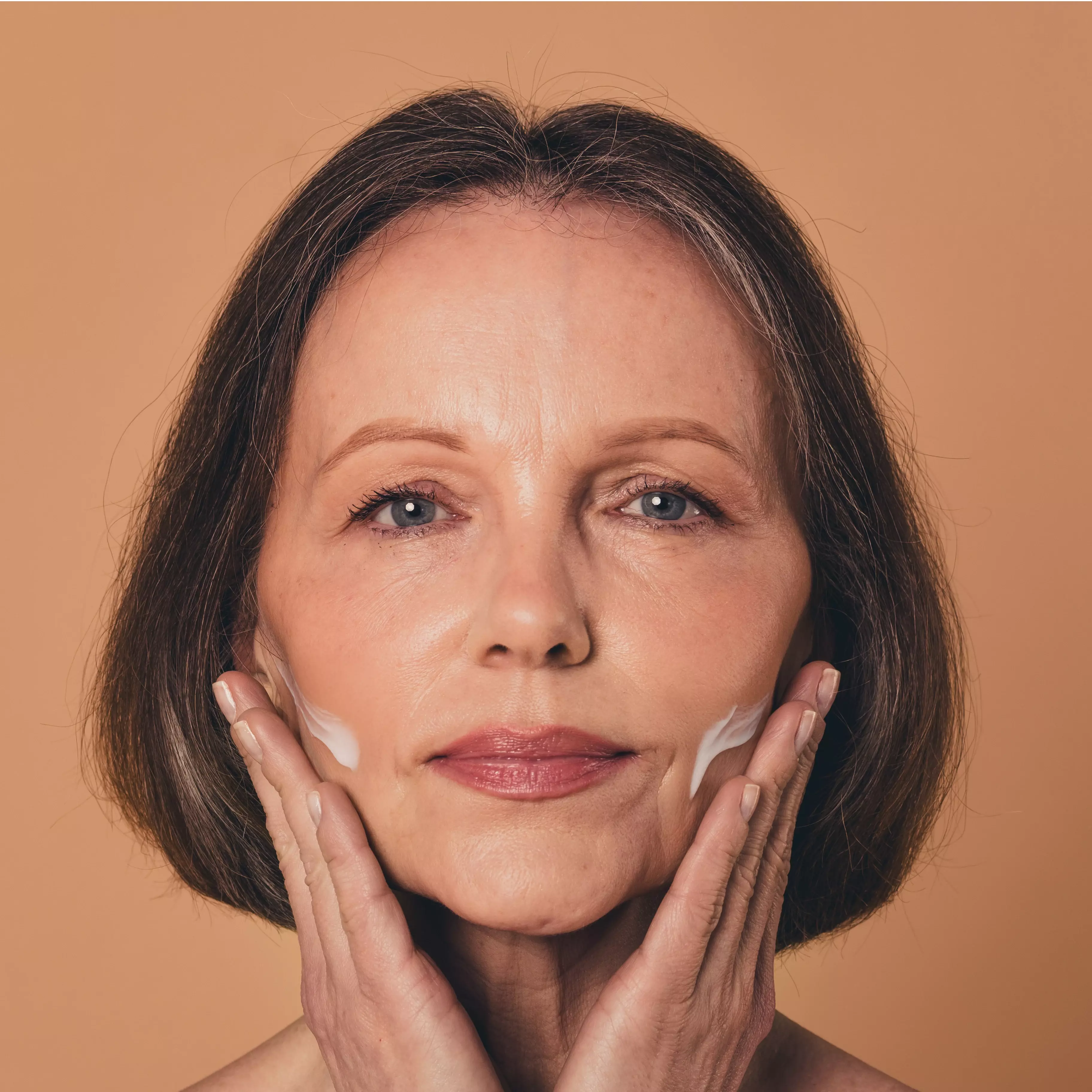 Massage it in — use firm, upward strokes over cheeks, jawline, forehead, and any areas that look deflated or feel thin.