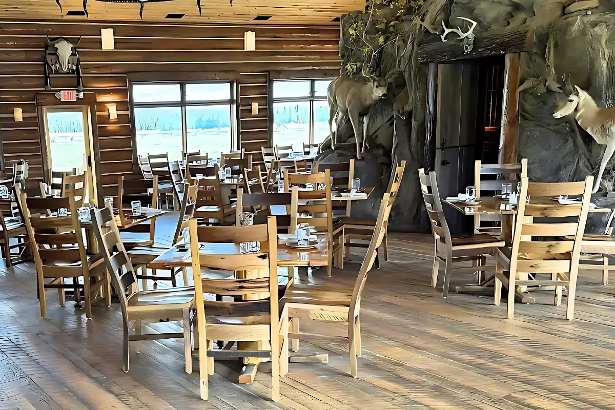 Rustic lodge dining room furnished with 100 custom Akron barnwood chairs