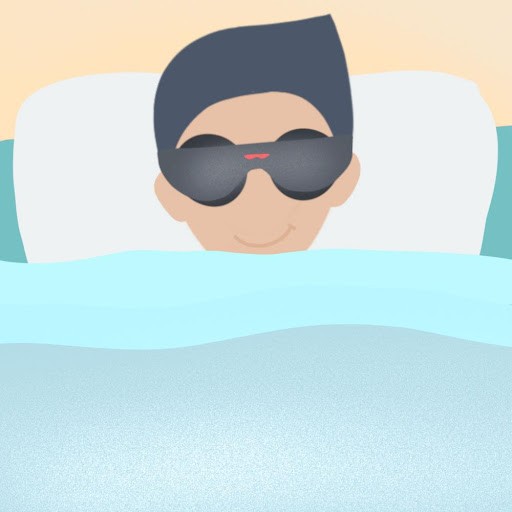 man sleeping with dark gray eye mask