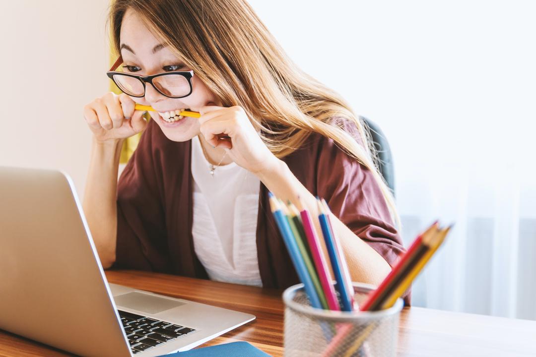 Woman Bitting Down on a pencil