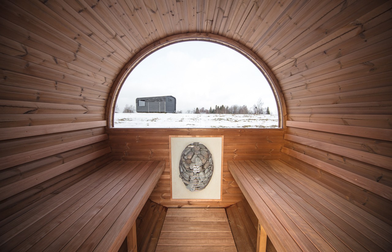 IMAGE OF THE INSIDE OF A BARREL SAUNA MADE WITH THERMALLY MODIFIED WOOD