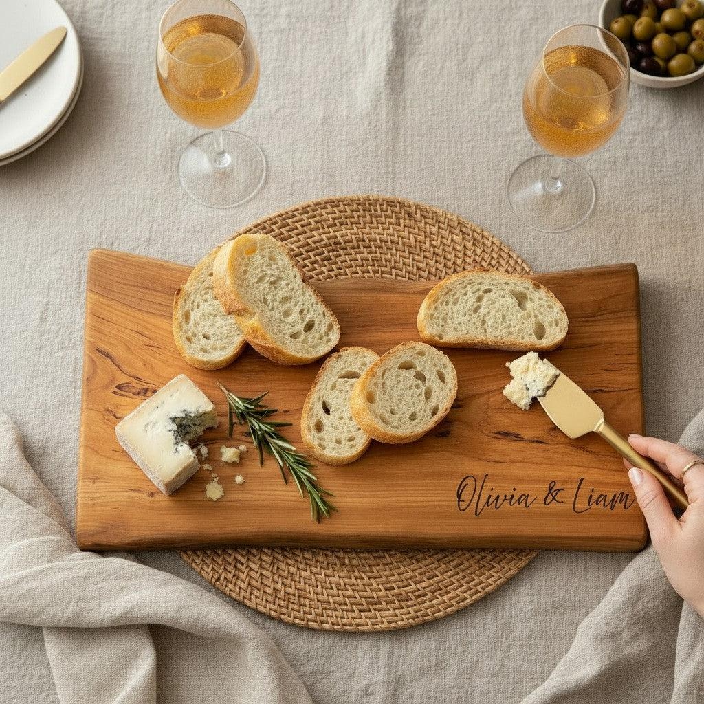 Personalized live edge cherry charcuterie board with natural edge and custom engraving