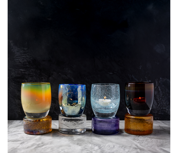Glassybaby pedestals glass blocks to lift votive holders in various colors