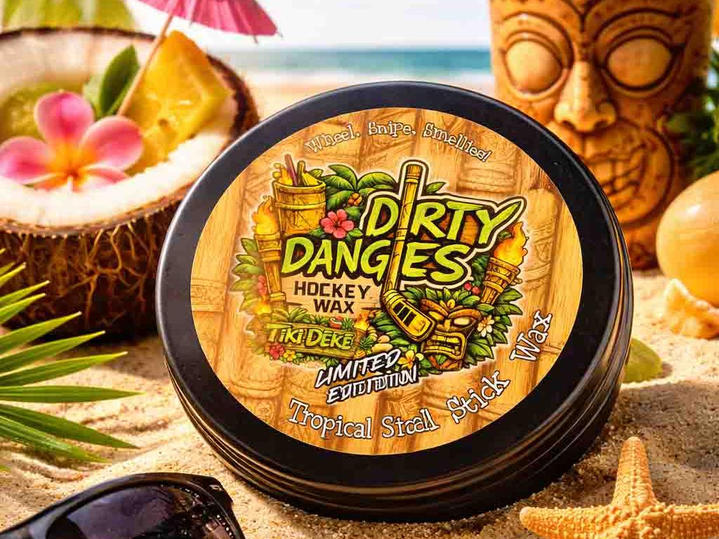 A tin of dirty dangles tiki deke limited edition tropical stick wax on a beach with tiki drinks and sea shells/\.