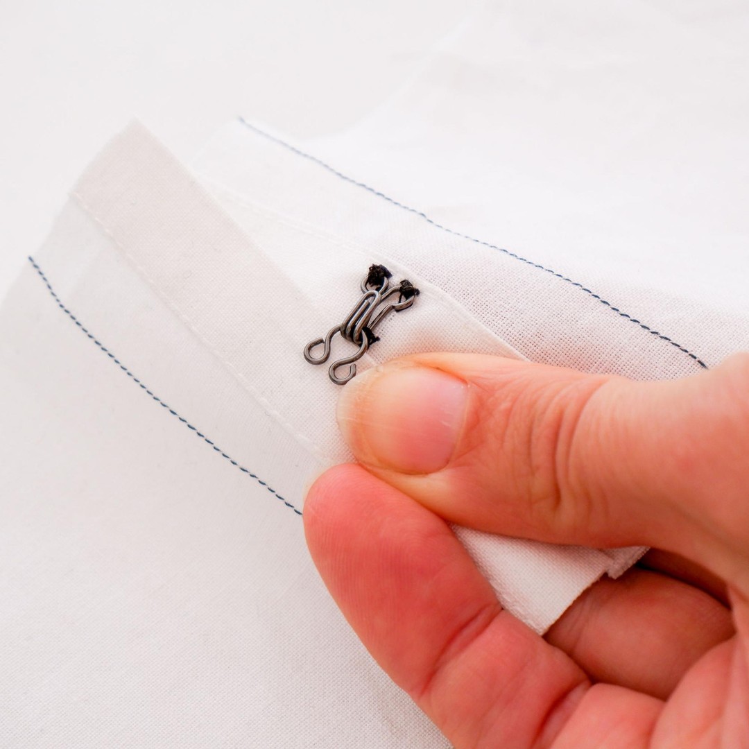 Use a temporary fabric marker to position the eye of the hook and eye set