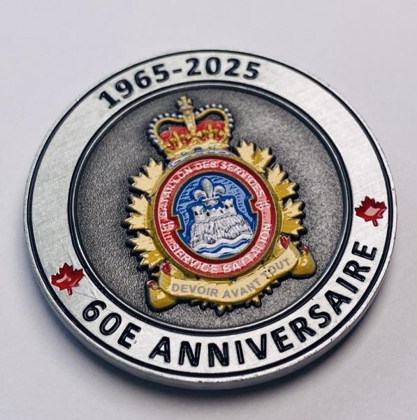Silver color coin with year engraving