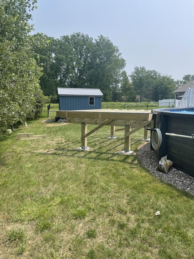 framed deck attached to pool