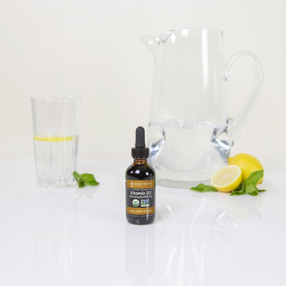 Global Healing Vitamin D3 bottle with water jug