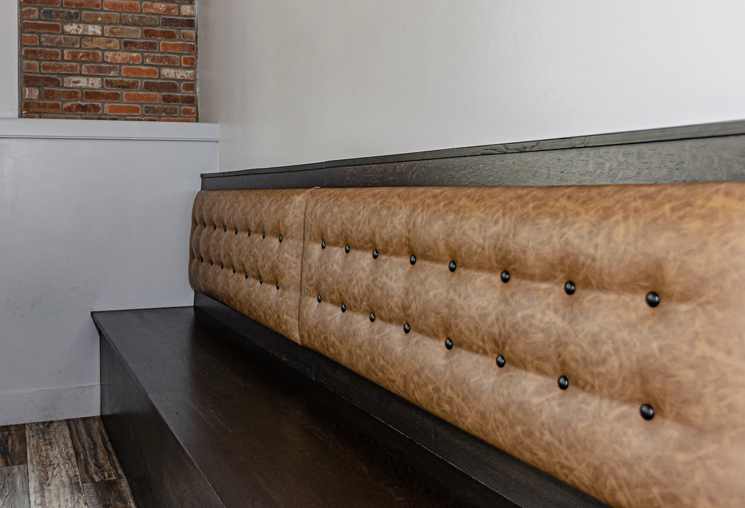 solid wood banquet seating with synthetic leather backing