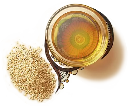 Sesame seed oil, in a transparent glass bowl, kept on an artwork of a flower, with sesame seeds on the side