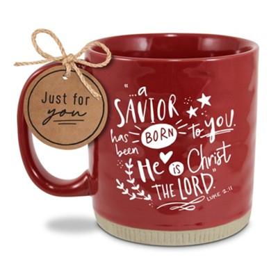 red mug with text "A Savior has been born to you. He is Christ the Lord"