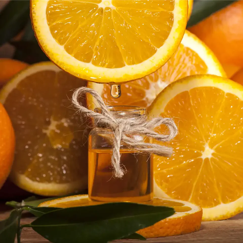 Oranges and a small bottle of oil
