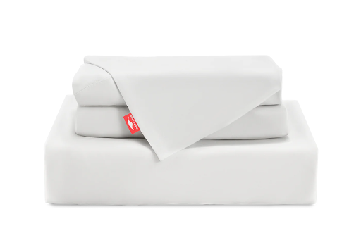 A stack of cooling bedding consisting of 1 white fitted sheet and 2 pillowcases.