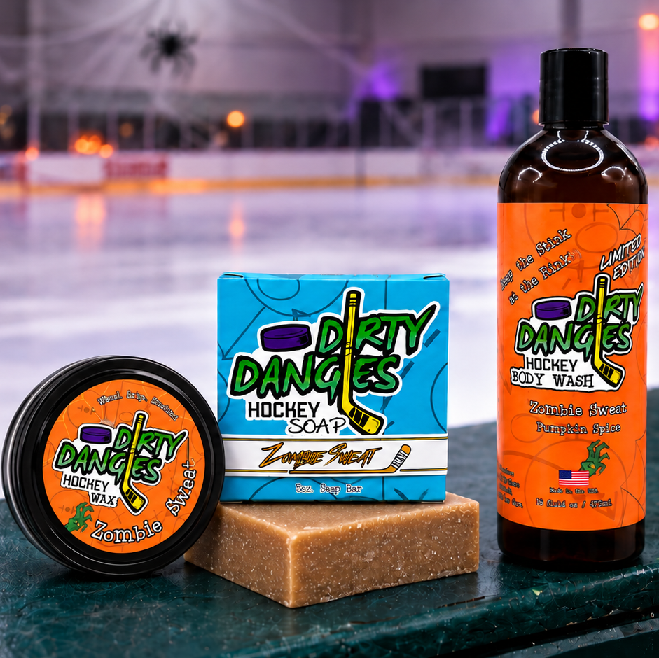 dirty dangles zombie sweat pumpkin spice scented bundle stick wax soap bar and body wash on hockey boards with halloween decor in the background