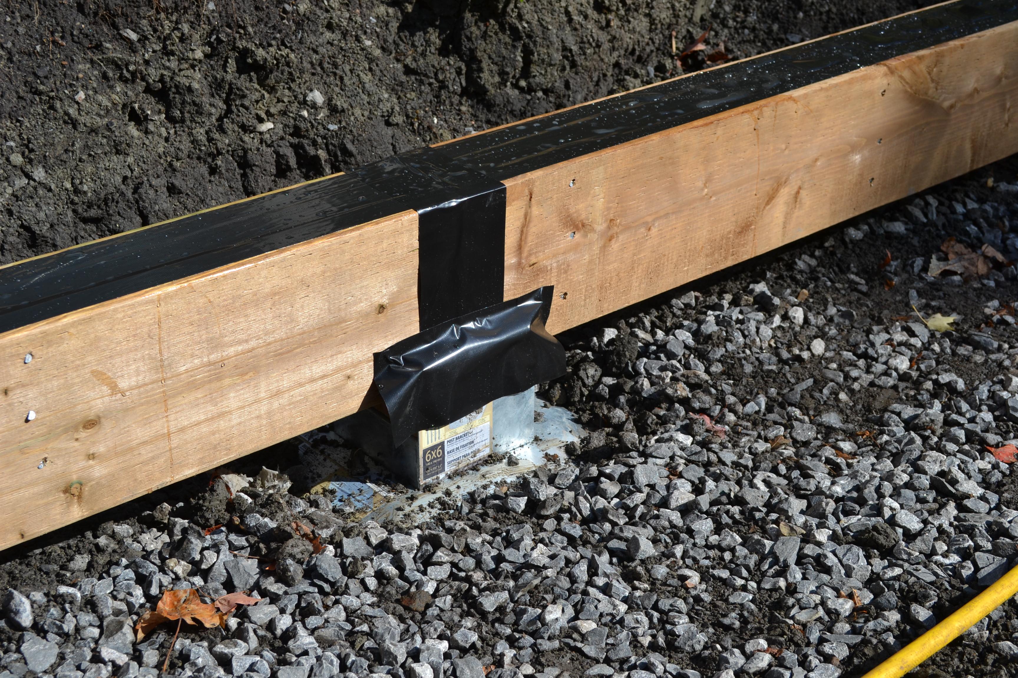 close up of a deck beam covered in joist tape for protection