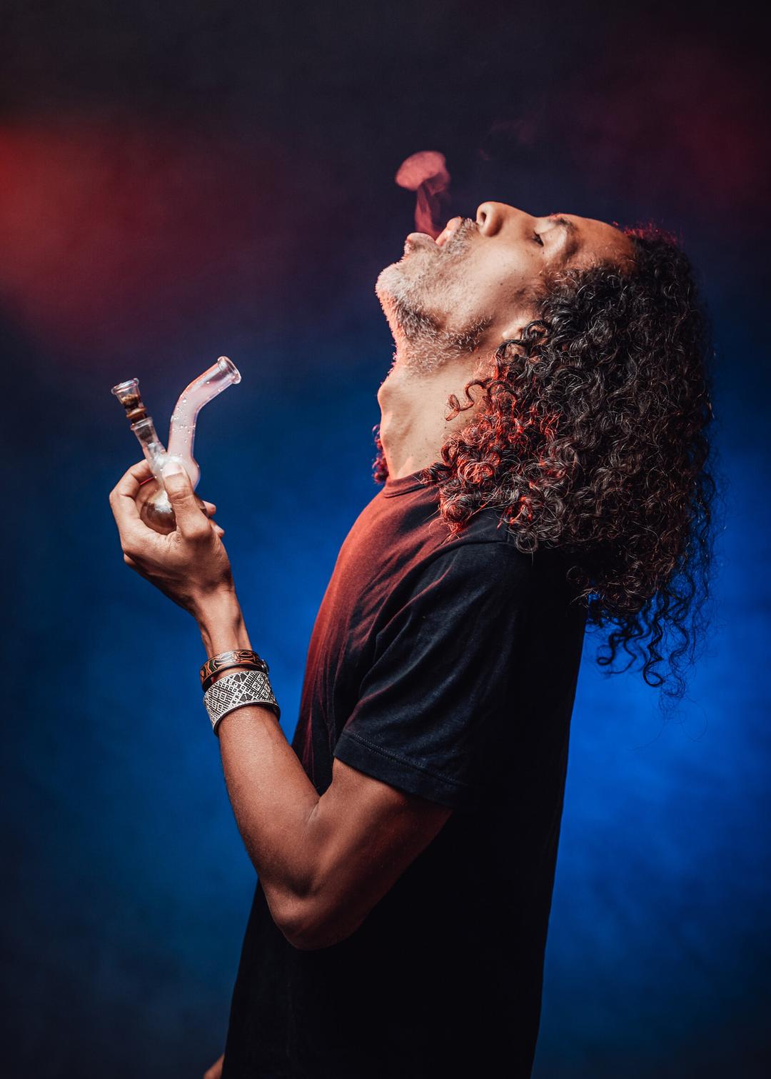 man smoking with bong