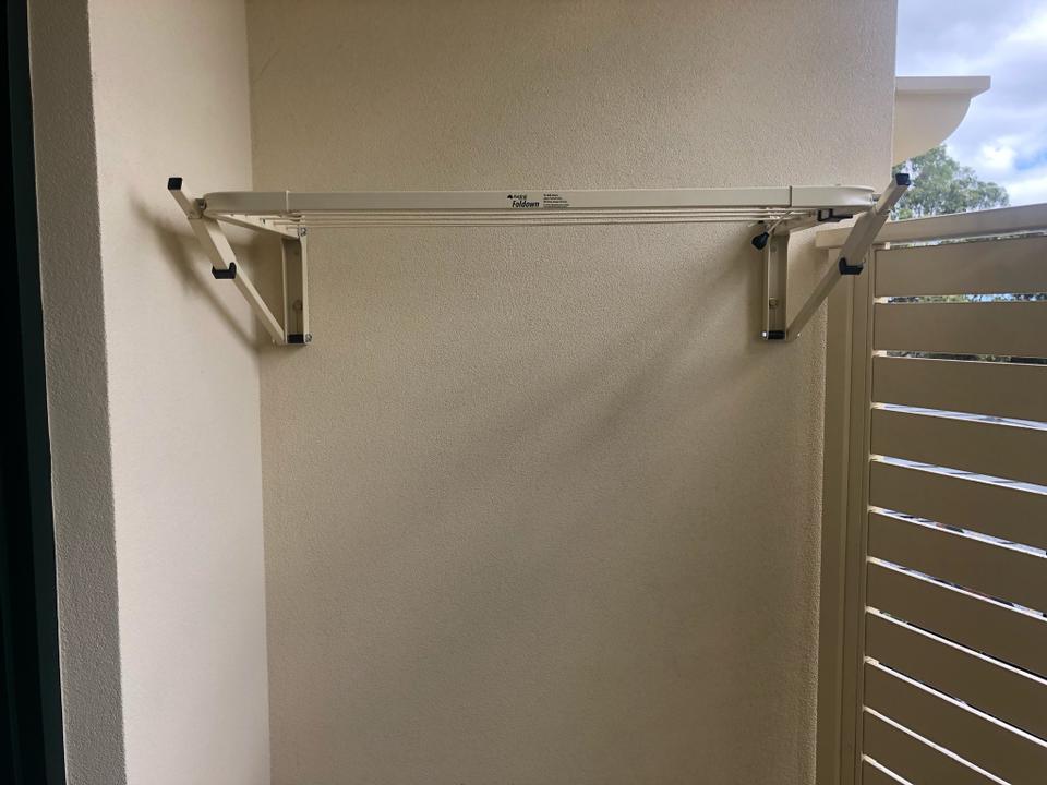 austral wall mounted clothesline on brick wall