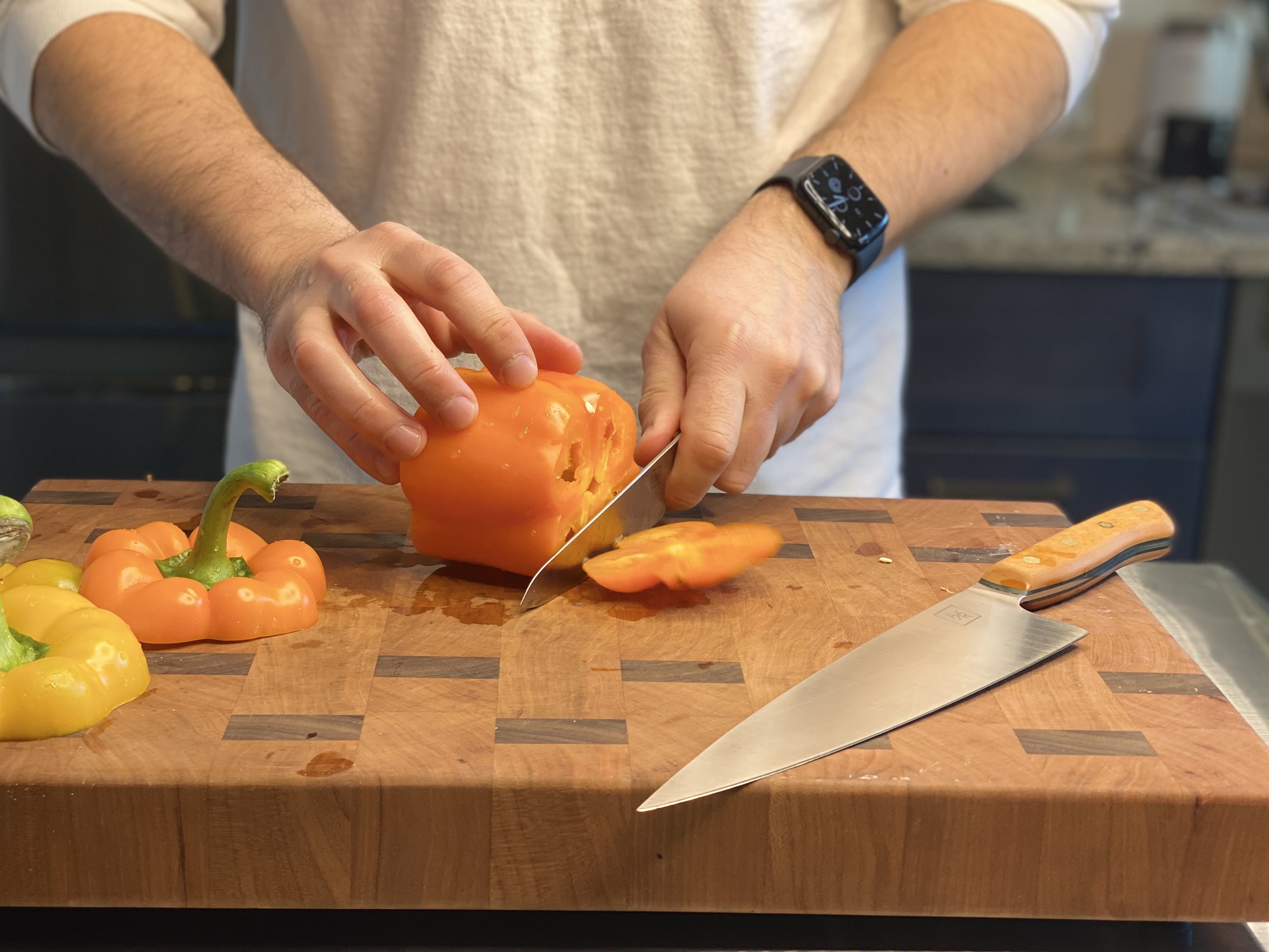 Cutting top and bottom off bell pepper