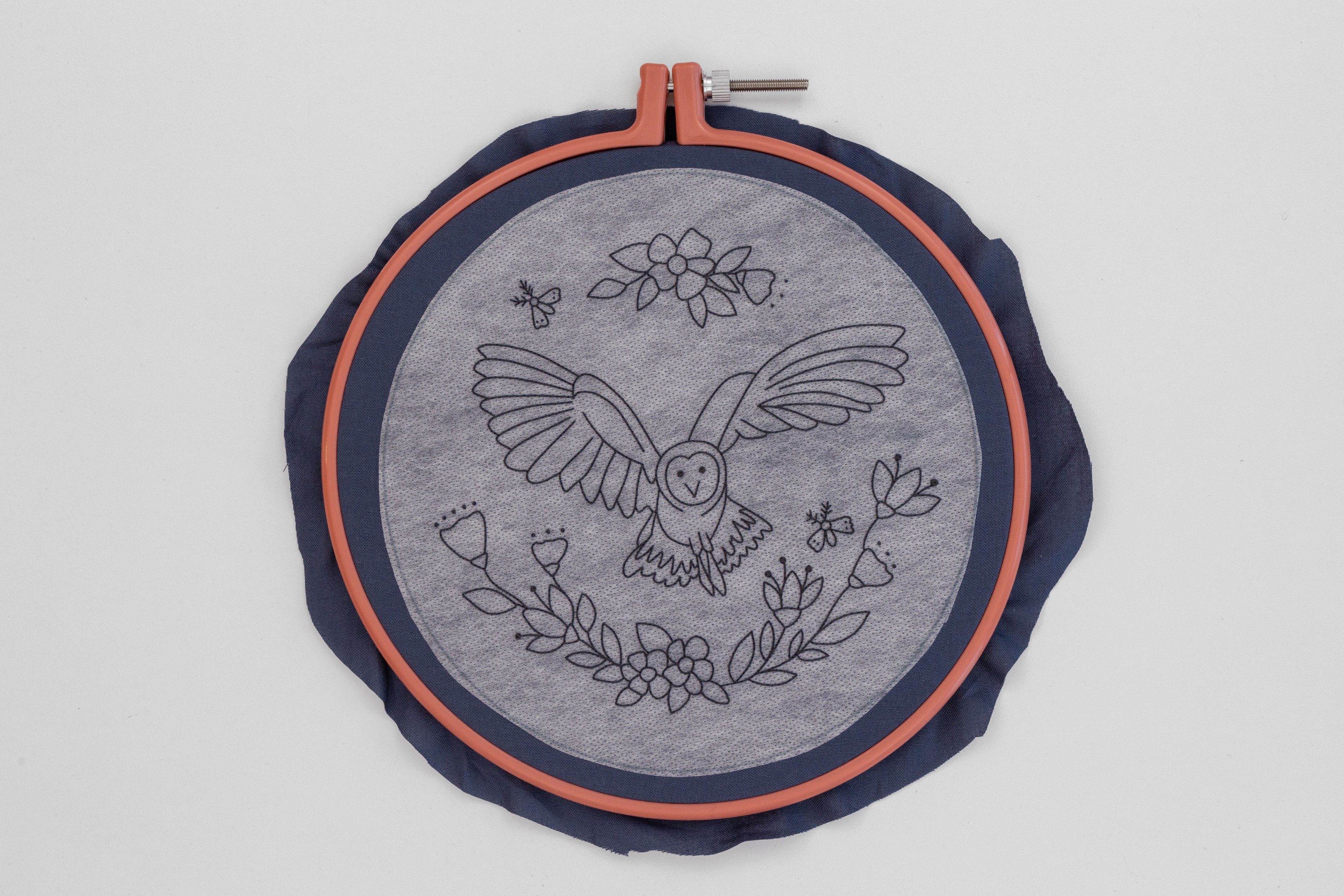 The Night Owl pattern is stuck onto the hoop.