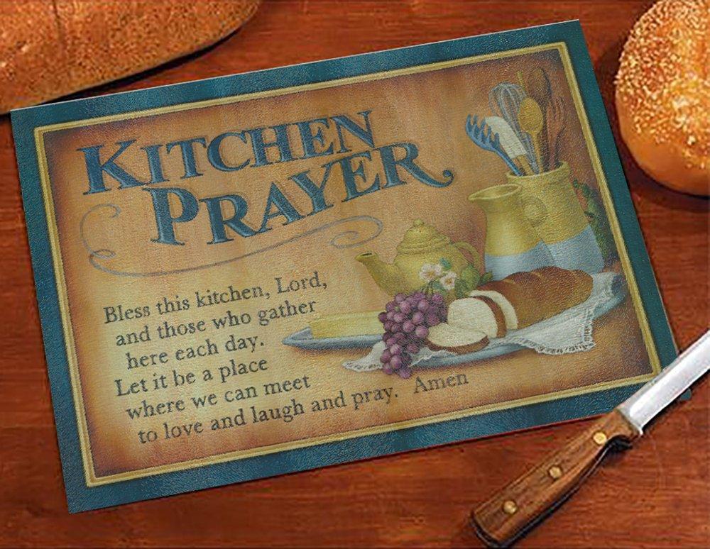 cutting board with a loaf of bread and kitchen prayer engraved