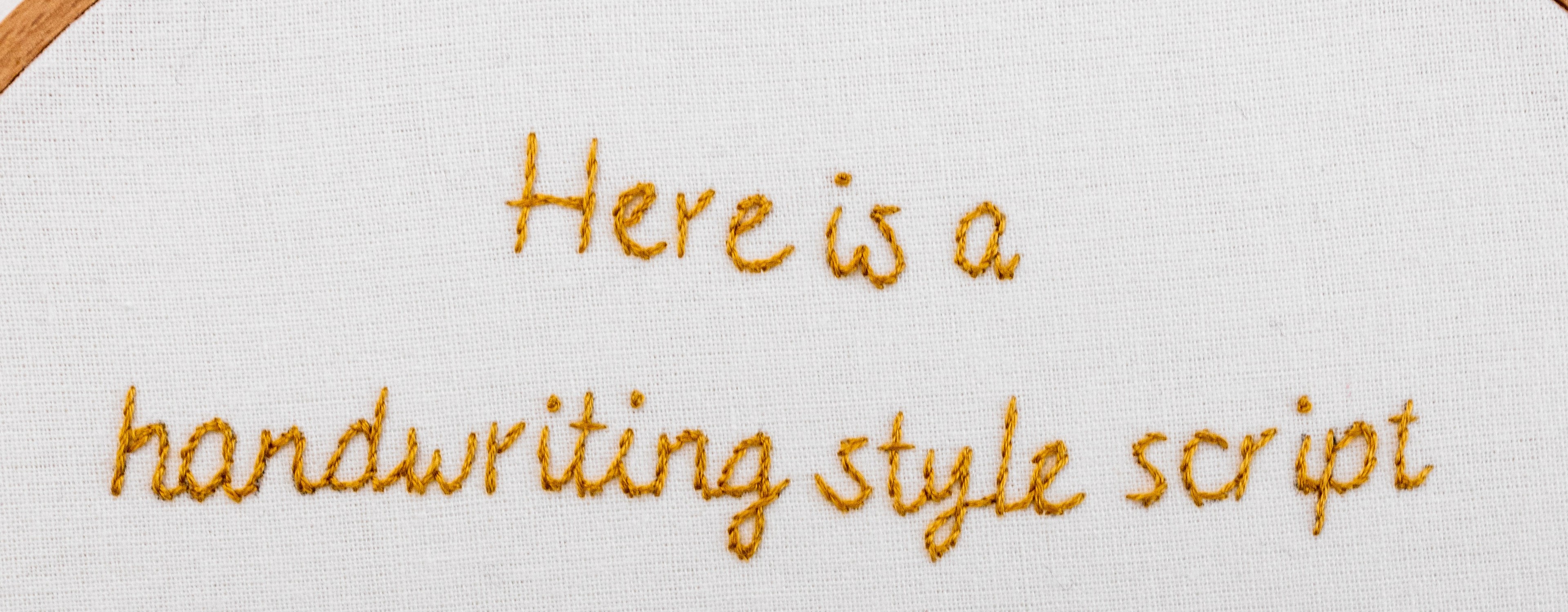 This is the front of a sentence stitched with modern embroidery lettering.