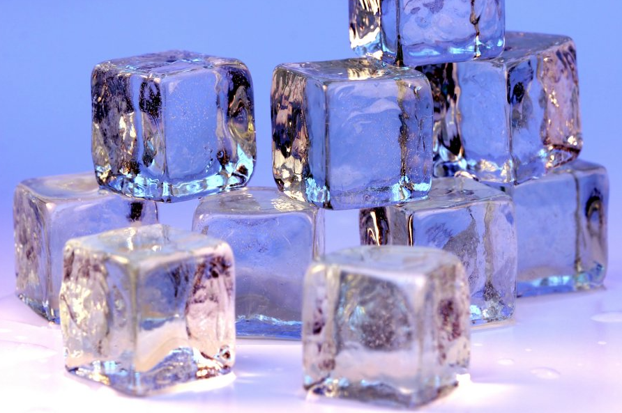 pile of ice cubes stock image