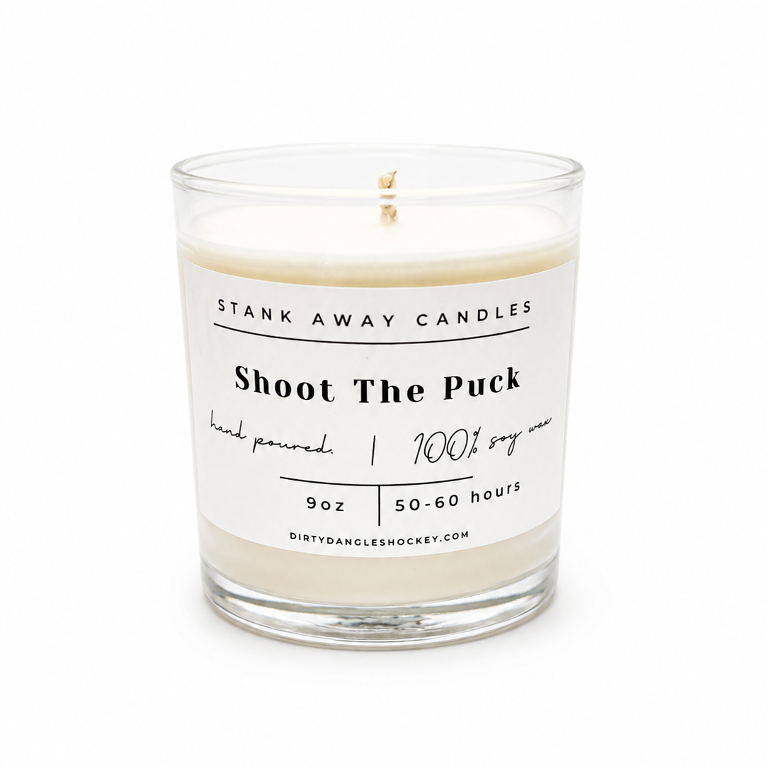 A white scented hockey candle on a white background. Shoot the puck