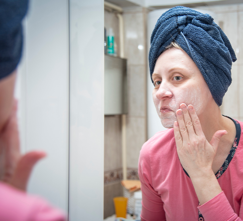 Woman using chemical peels and exfoliators