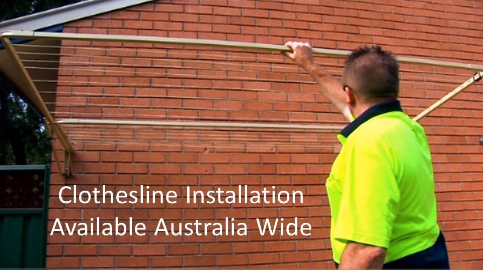 2.2m wide clothesline installation service showing clothesline installer with clothesline installed to brick wall