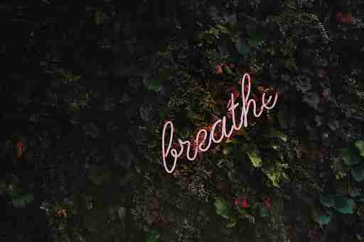 just breathe meditate sign